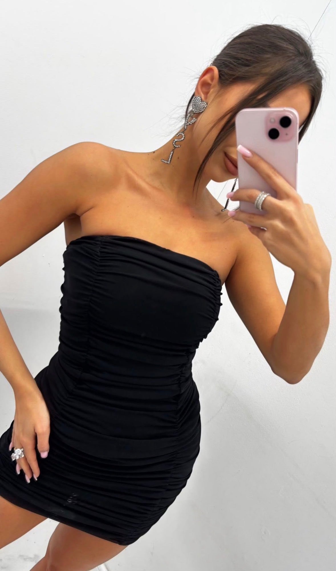 Sabina black ruched bandeau dress styled at mini length, close front view
