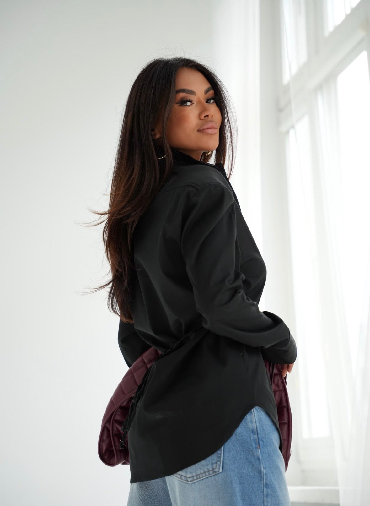 Elizabeth Tailored Shirt in Black, adjustable back ties and curved hem view