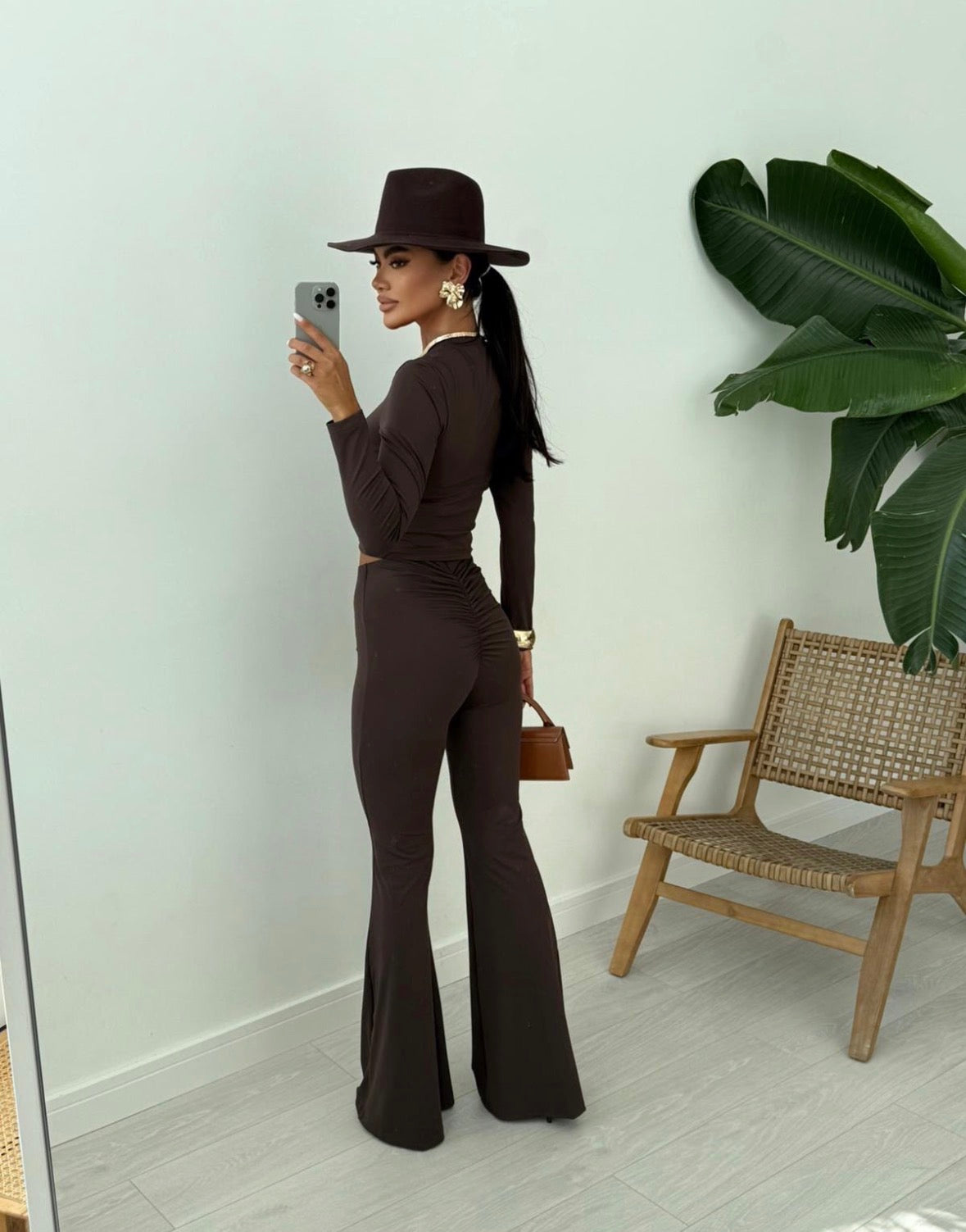 Cleo Scrunch Flared Leggings in Brown, rear full-length view